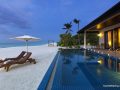 SUNSET POOL VILLA - AT DUSK WITH SWING AND SANDBANK IN BACKGROUND